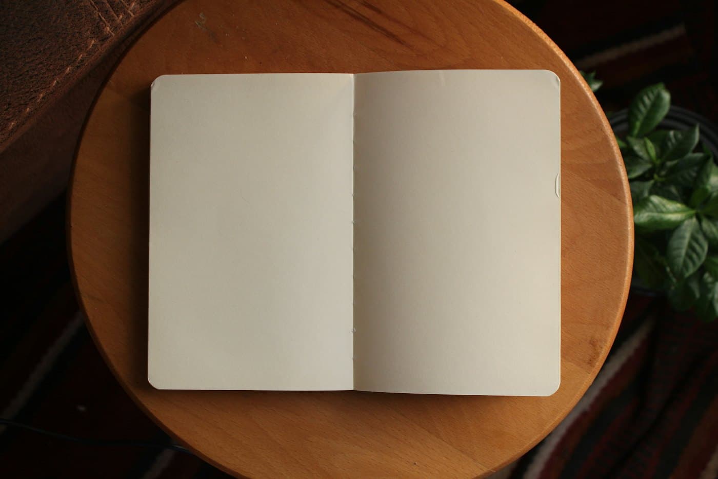 An open notebook on a warm wooden table