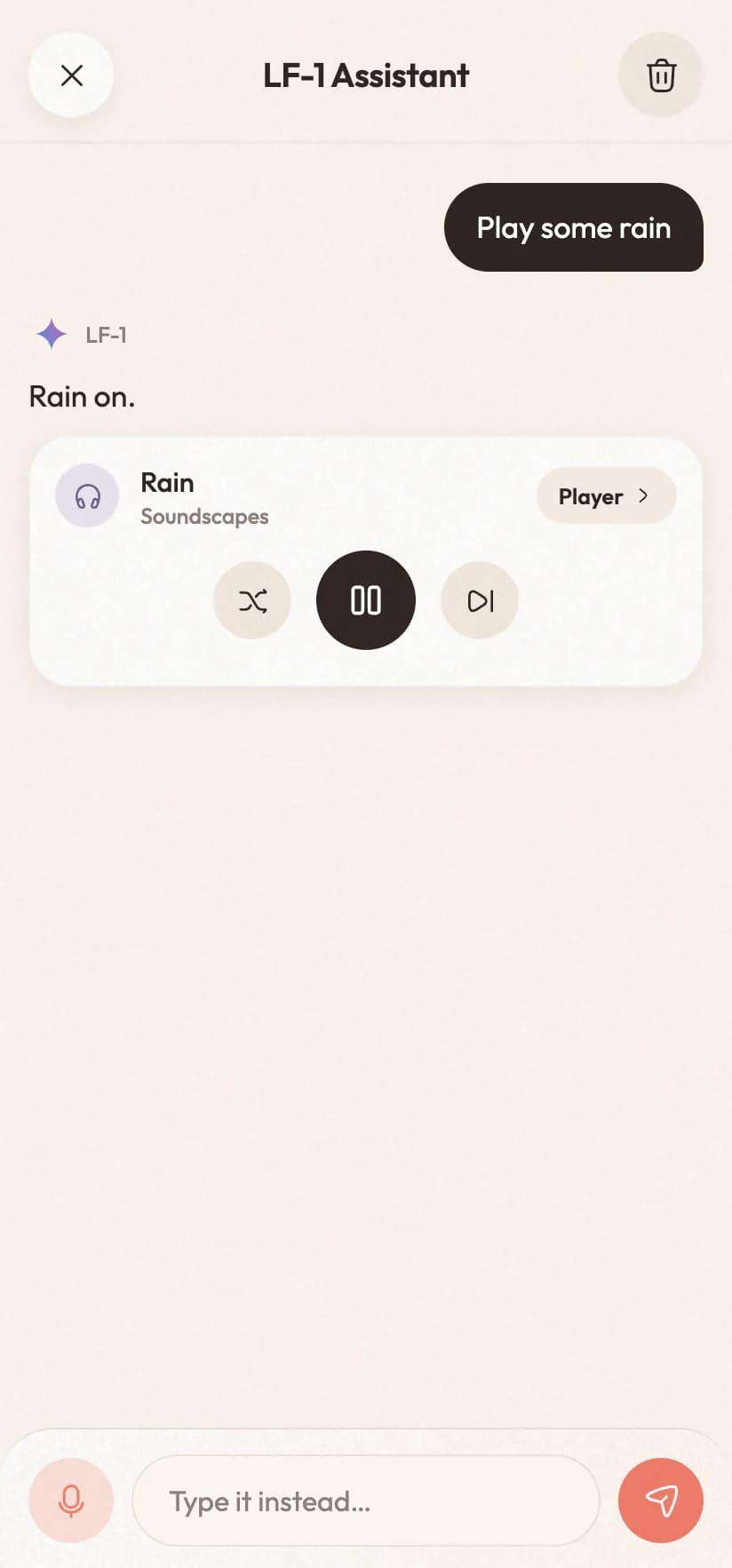 The assistant answering “Play some rain” with a player card